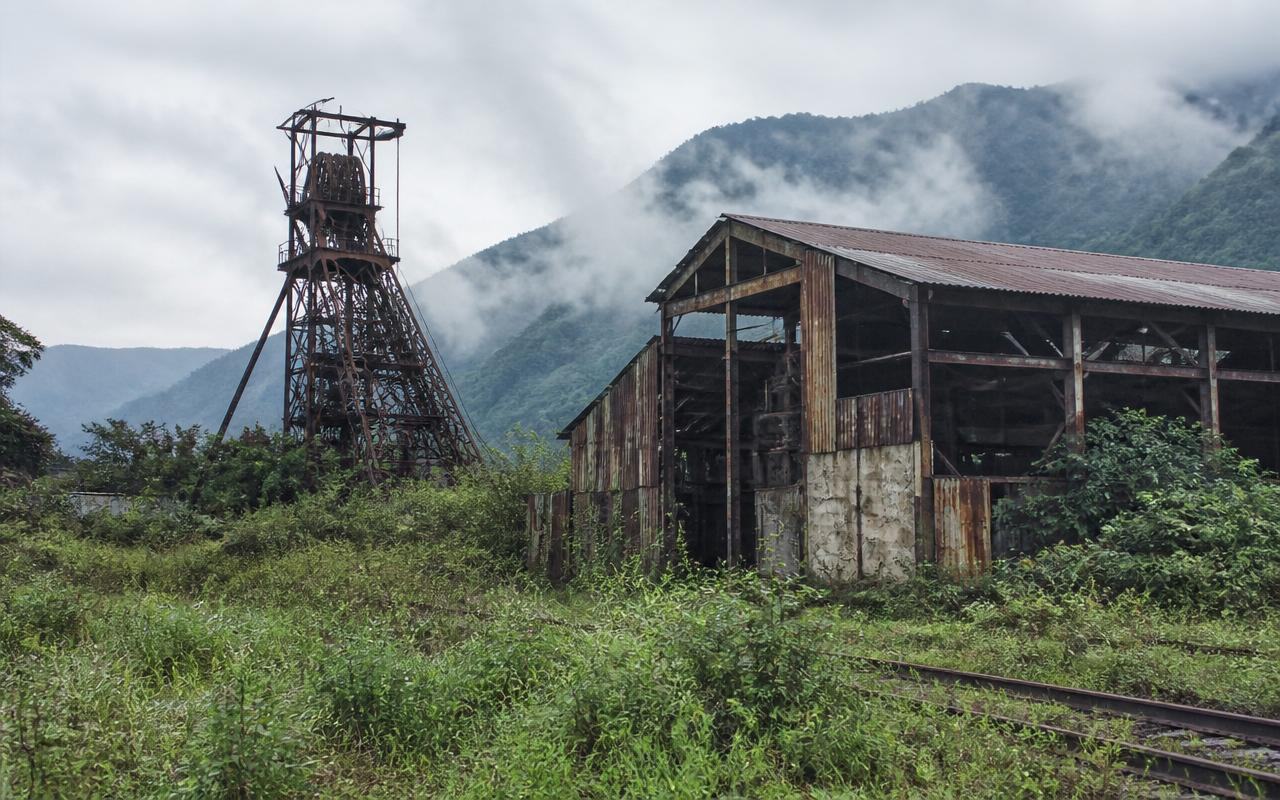 Disused headframe and rehabilitation works at the Kilembe copper mine in Kasese